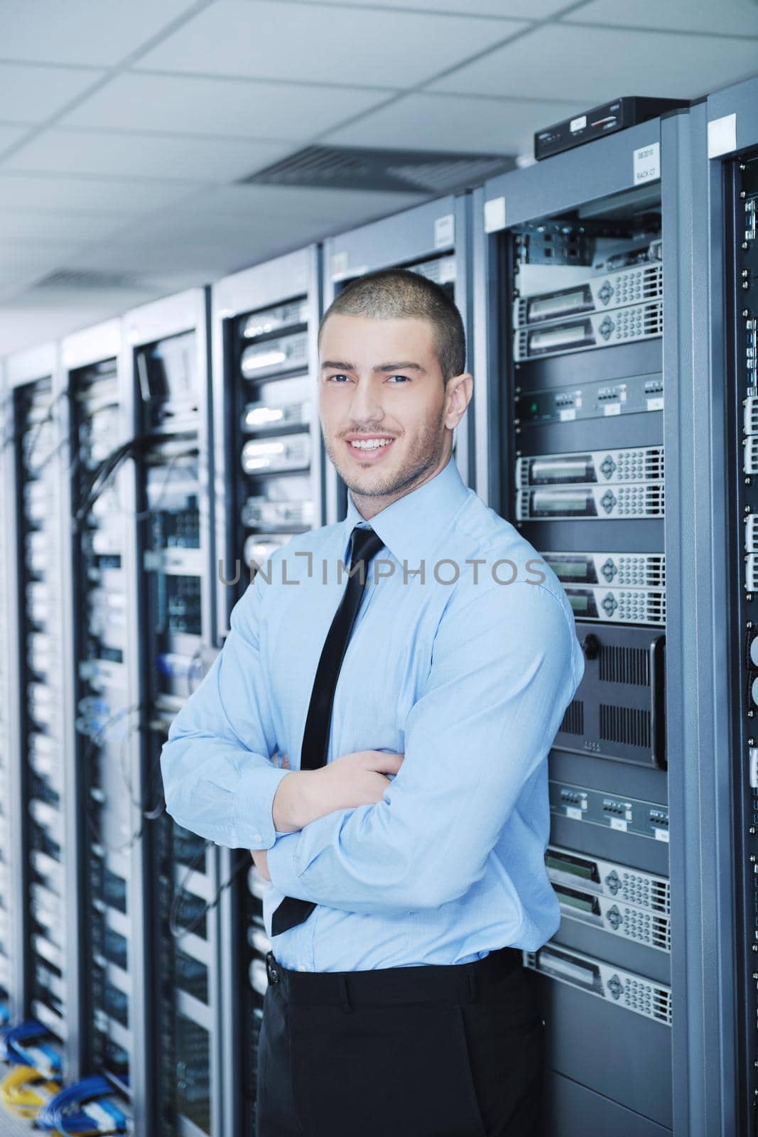 young handsome business man  engineer in datacenter server room