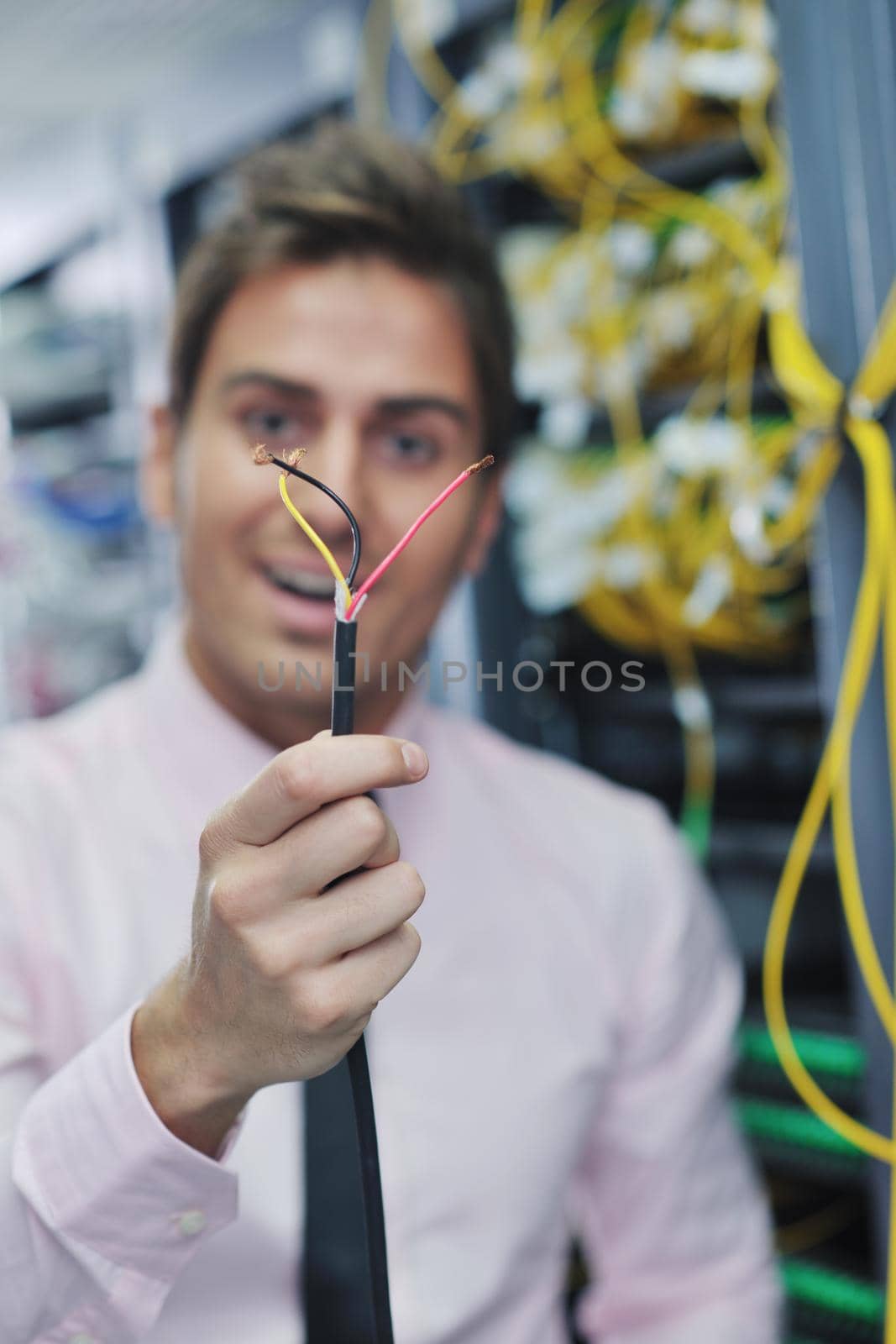 it business man in network server room have problems and looking for  disaster situation  solution