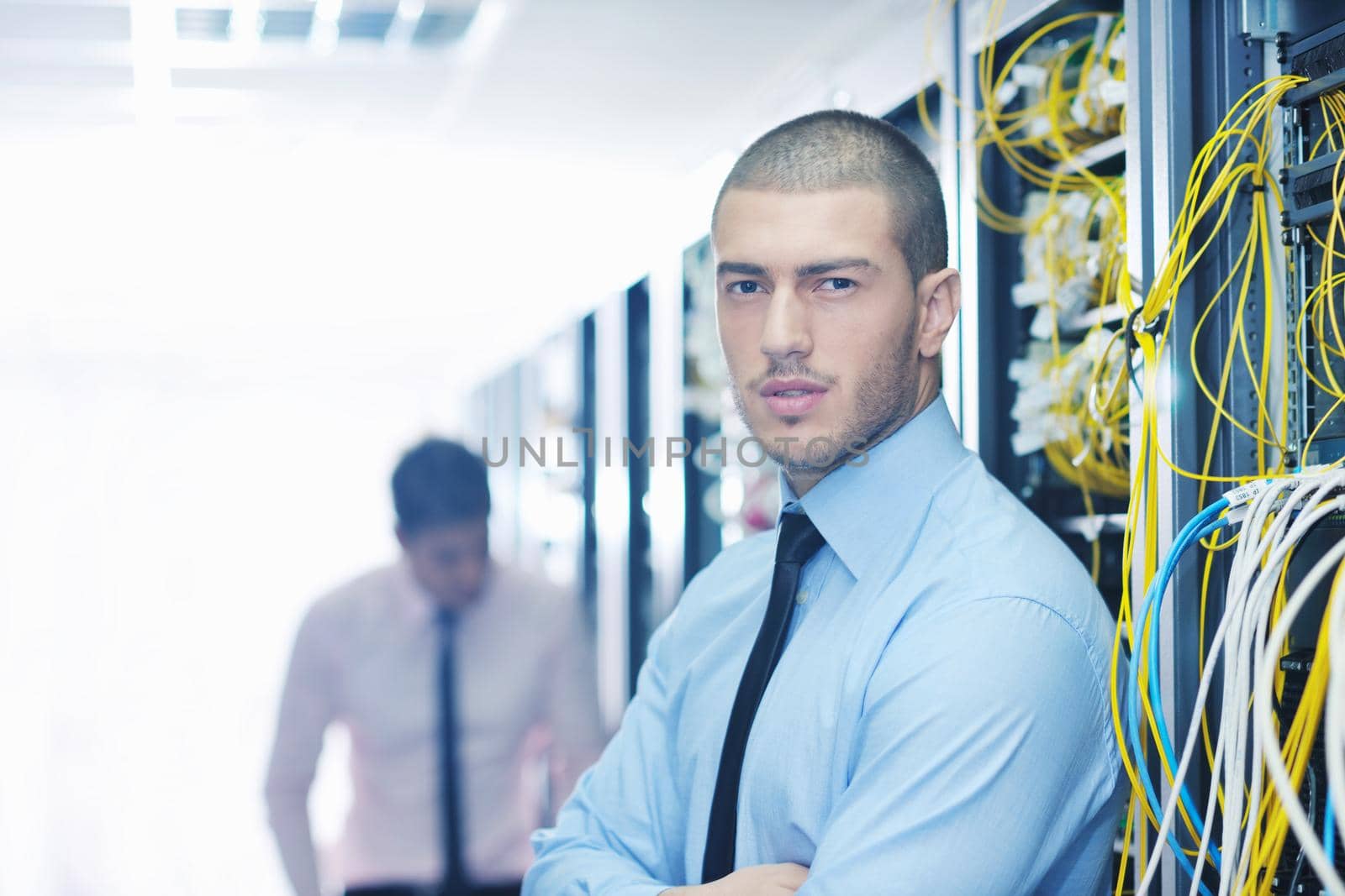 it engineers in network server room by dotshock