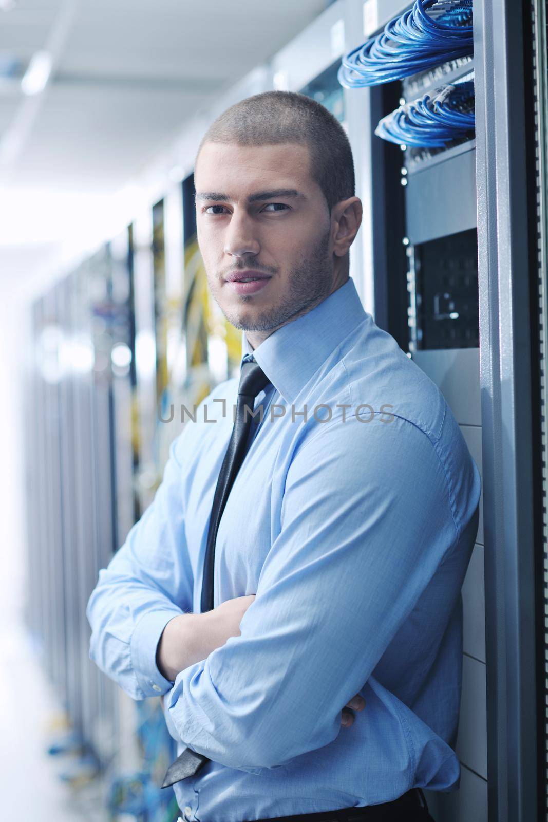 young handsome business man  engeneer in datacenter server room