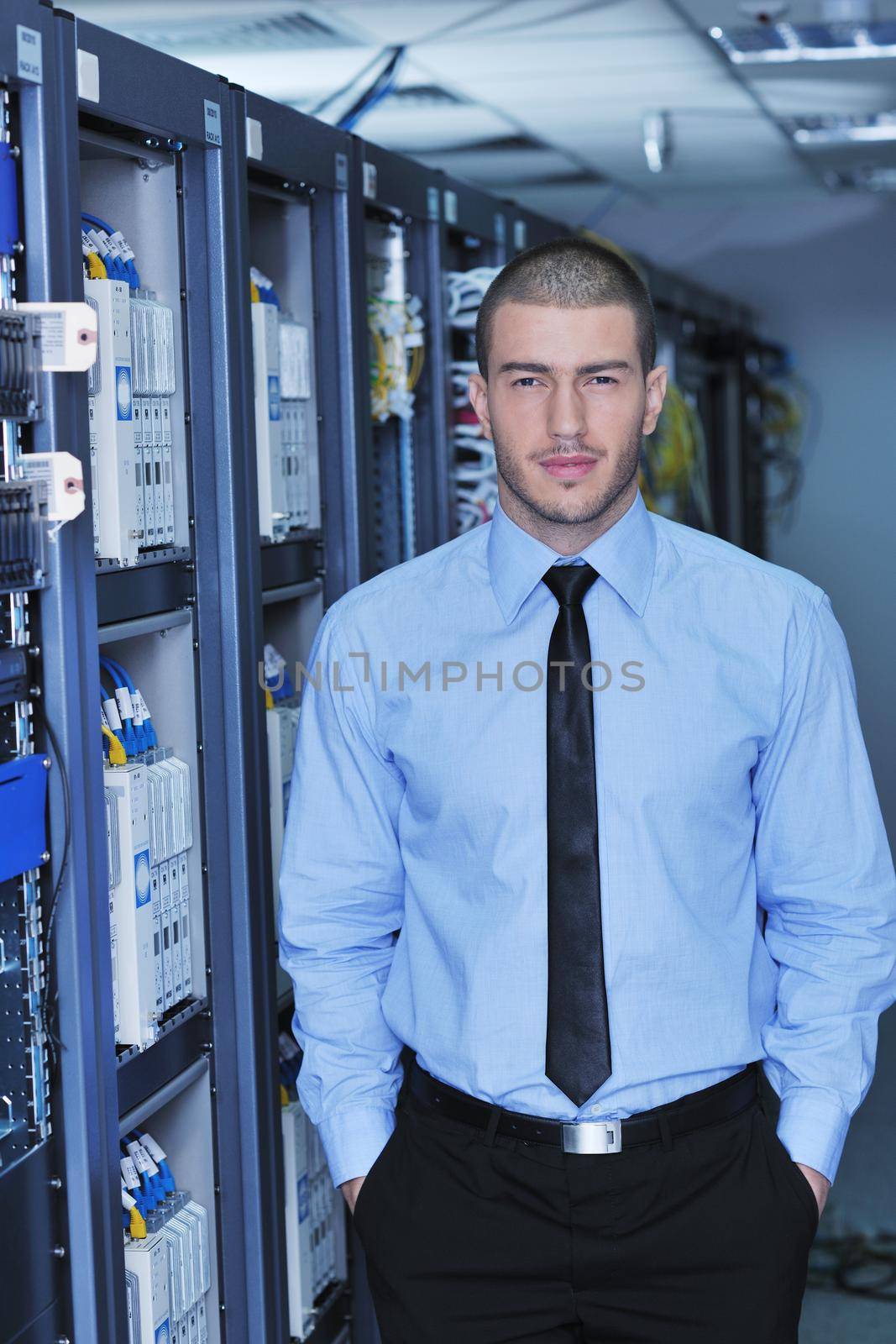 young handsome business man  engeneer in datacenter server room