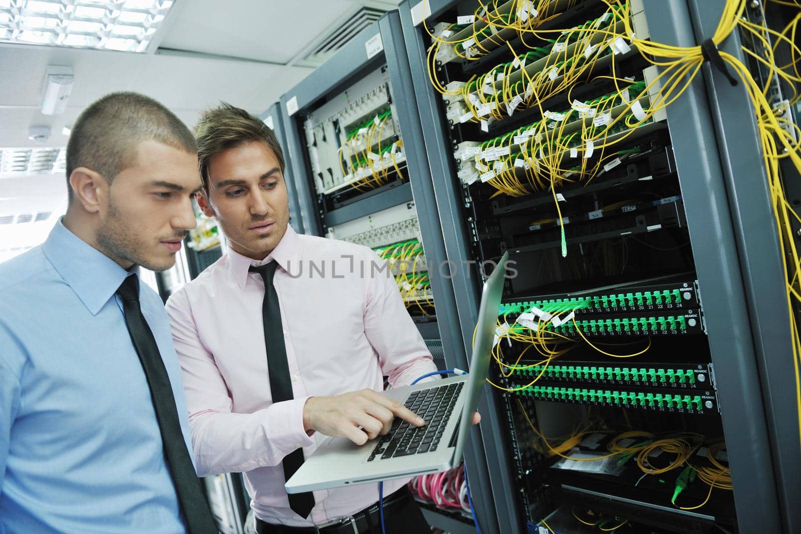 it engineers in network server room by dotshock