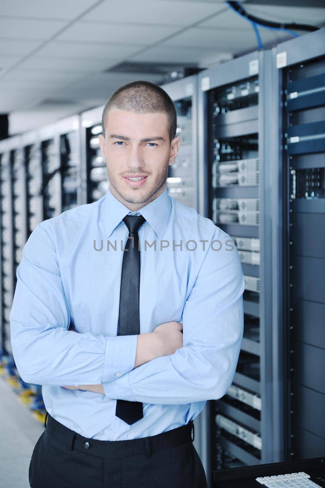 young handsome business man  engineer in datacenter server room