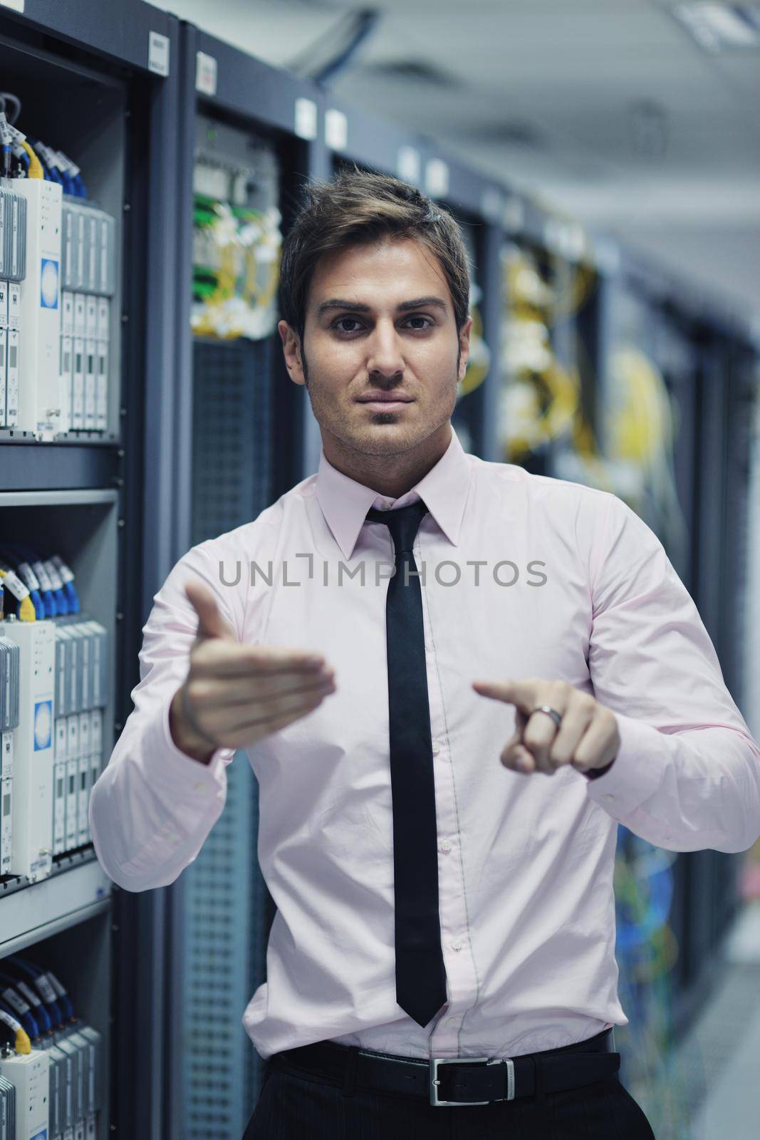 young handsome business man  engeneer in datacenter server room