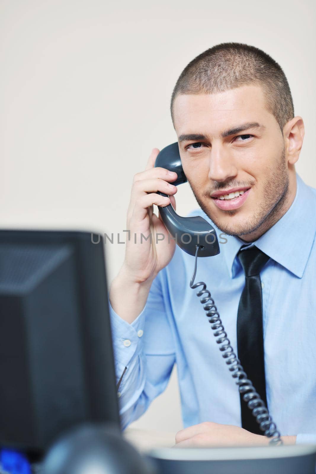 businessman with a headset portrait at bright call center helpdesk support office