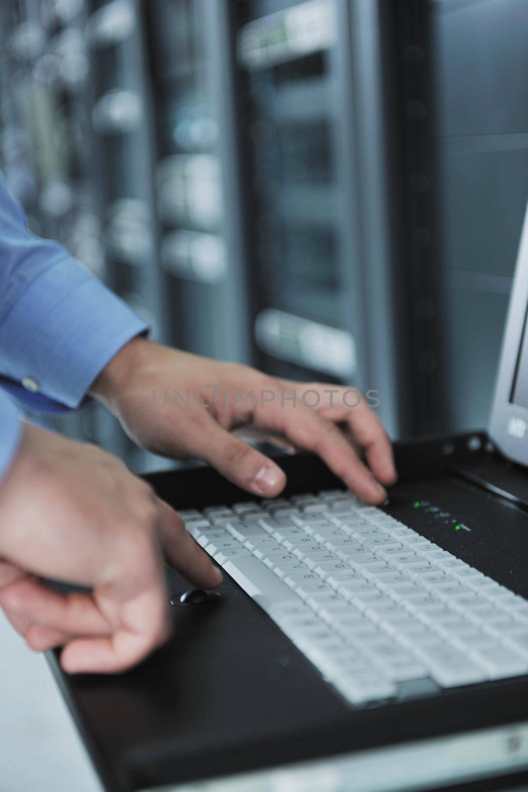 young handsome business man  engeneer in datacenter server room