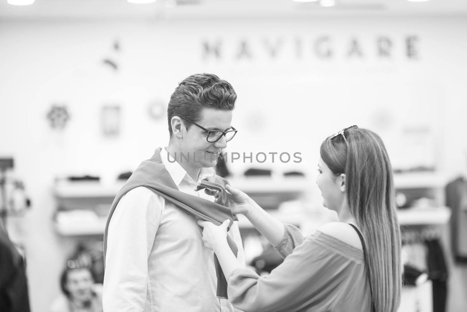 Attractive Couple Shopping In A Man's Clothing Store