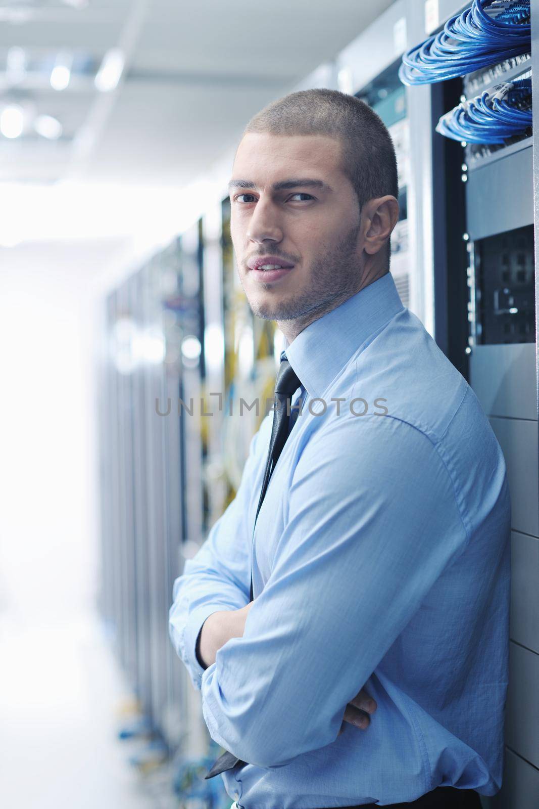 young handsome business man  engeneer in datacenter server room