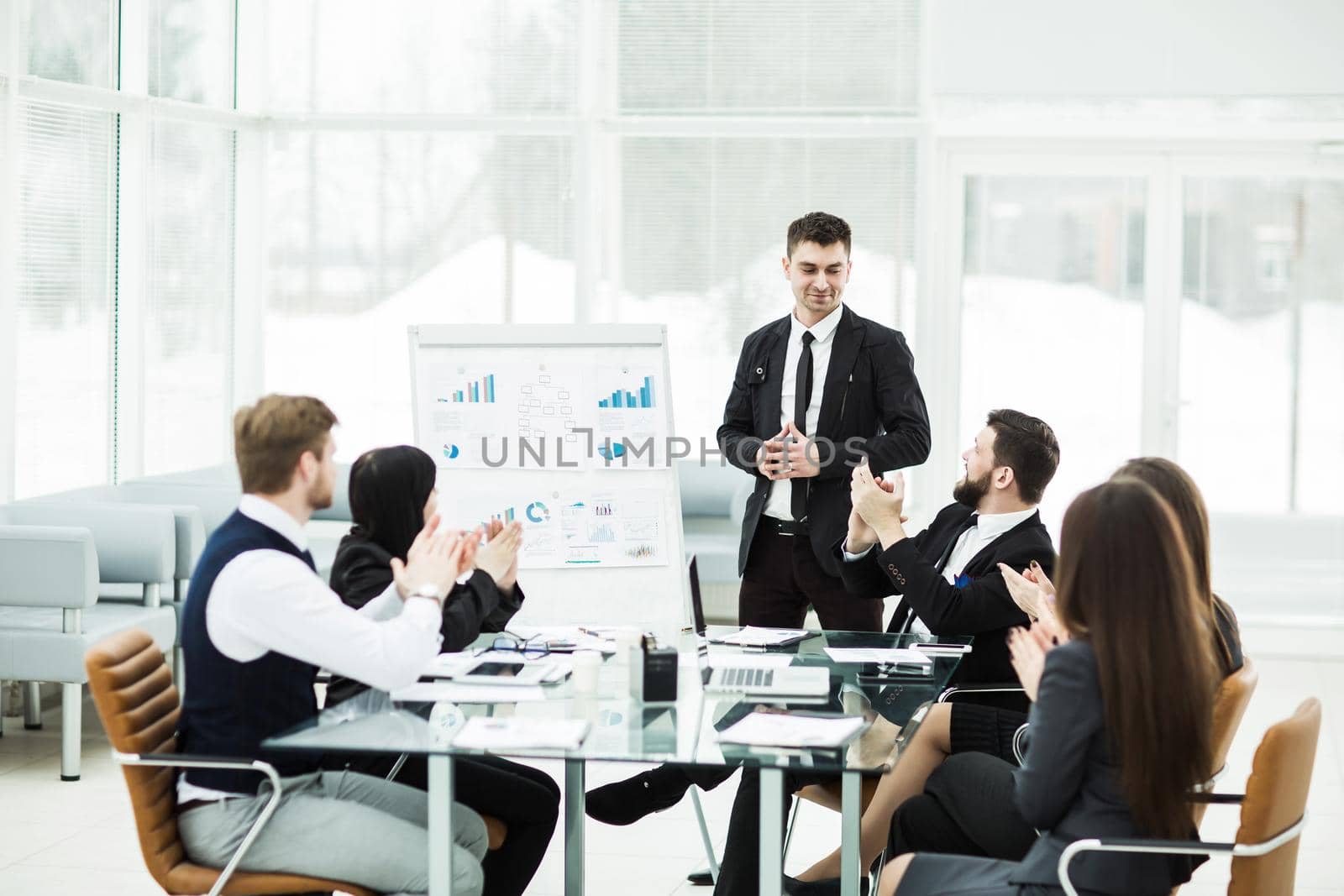 business team gives a presentation of a new financial project for the business partners of the company . the photo has a empty space for your text.