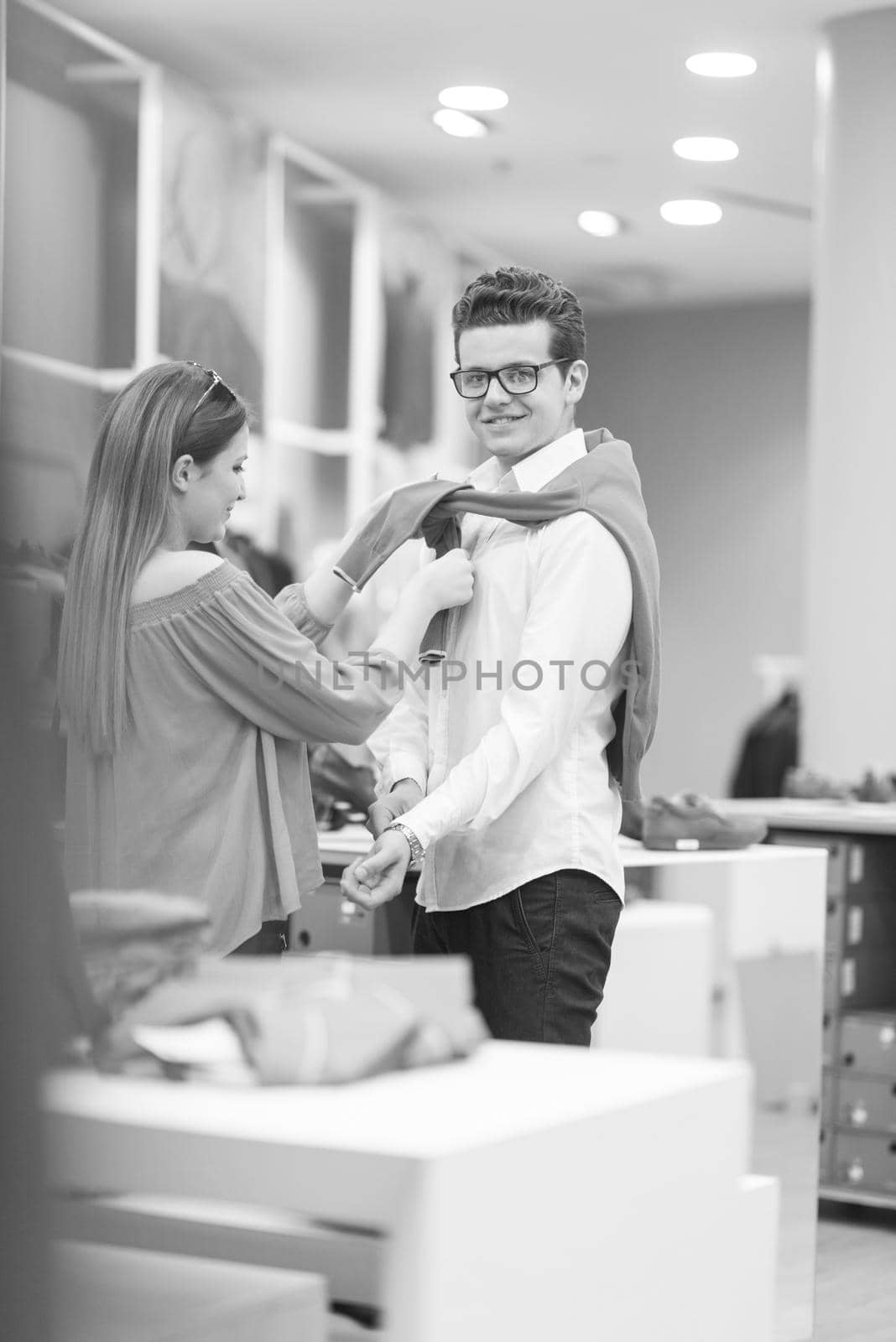 Attractive Couple Shopping In A Man's Clothing Store