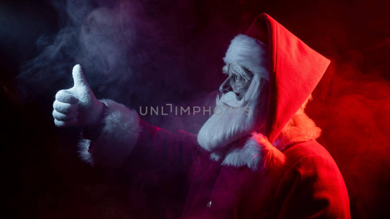 Santa claus in neon light on a black background. Christmas party. by mrwed54