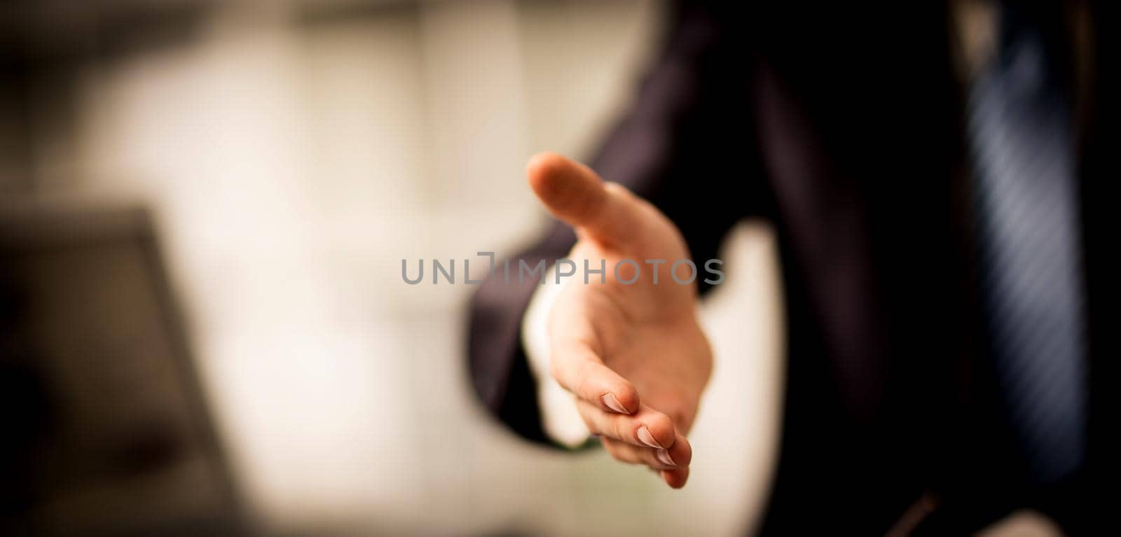 Portrait of successful businesswoman giving hand for the transaction is ready to cooperate
