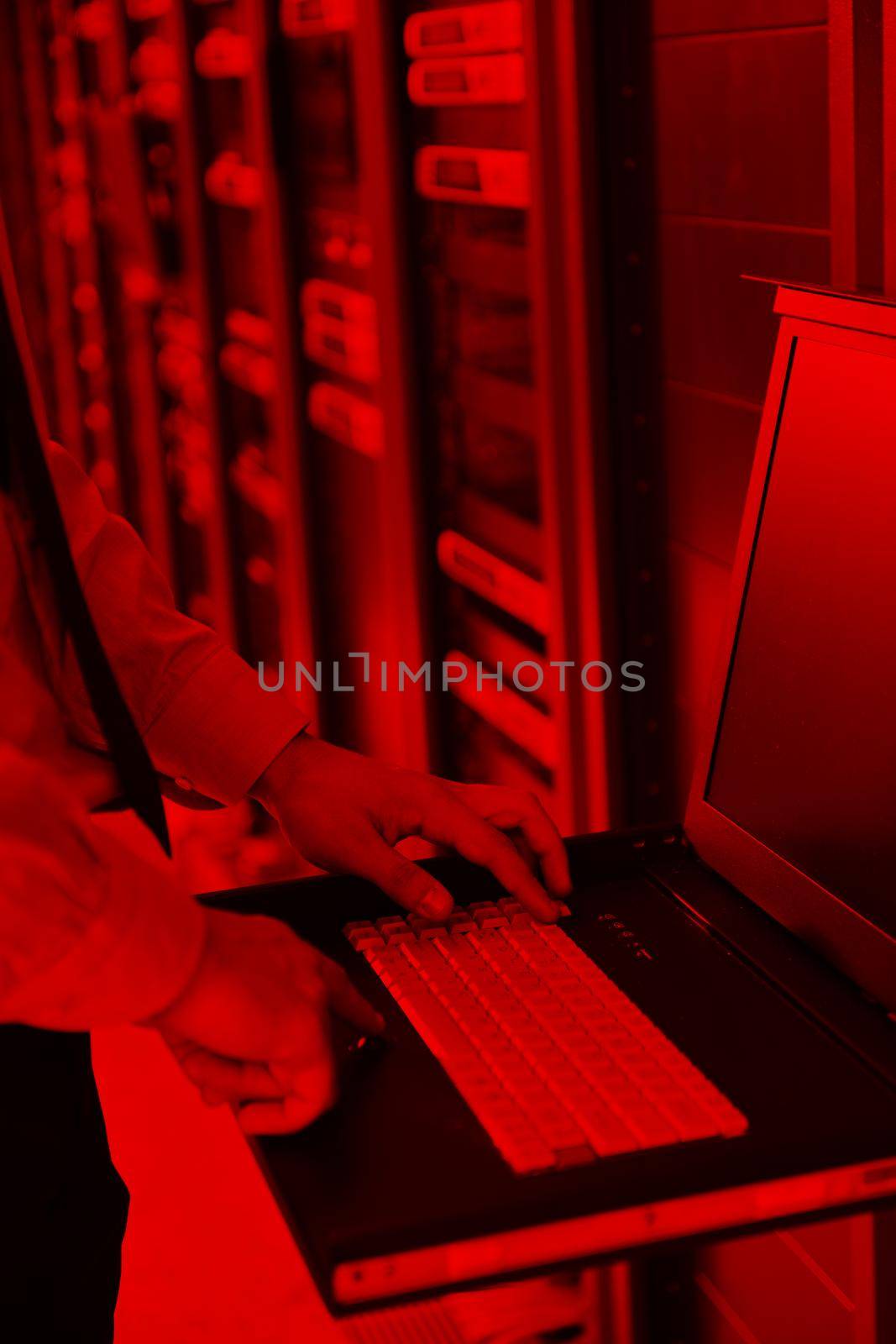 young handsome business man  engeneer in datacenter server room