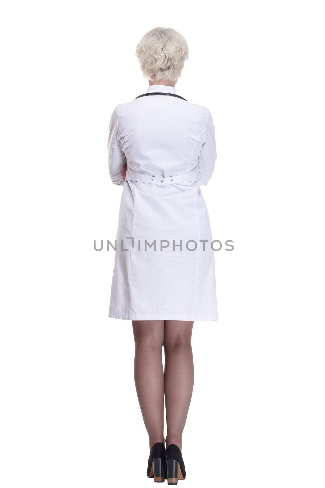 rear view. young woman doctor reading an ad on a white screen . isolated on a white background.