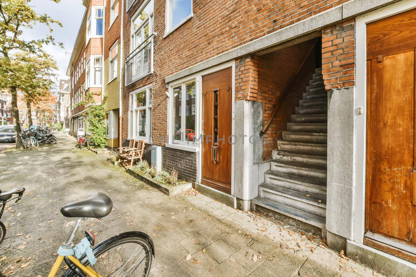 Adorable brick building with stairs and bicycle parking