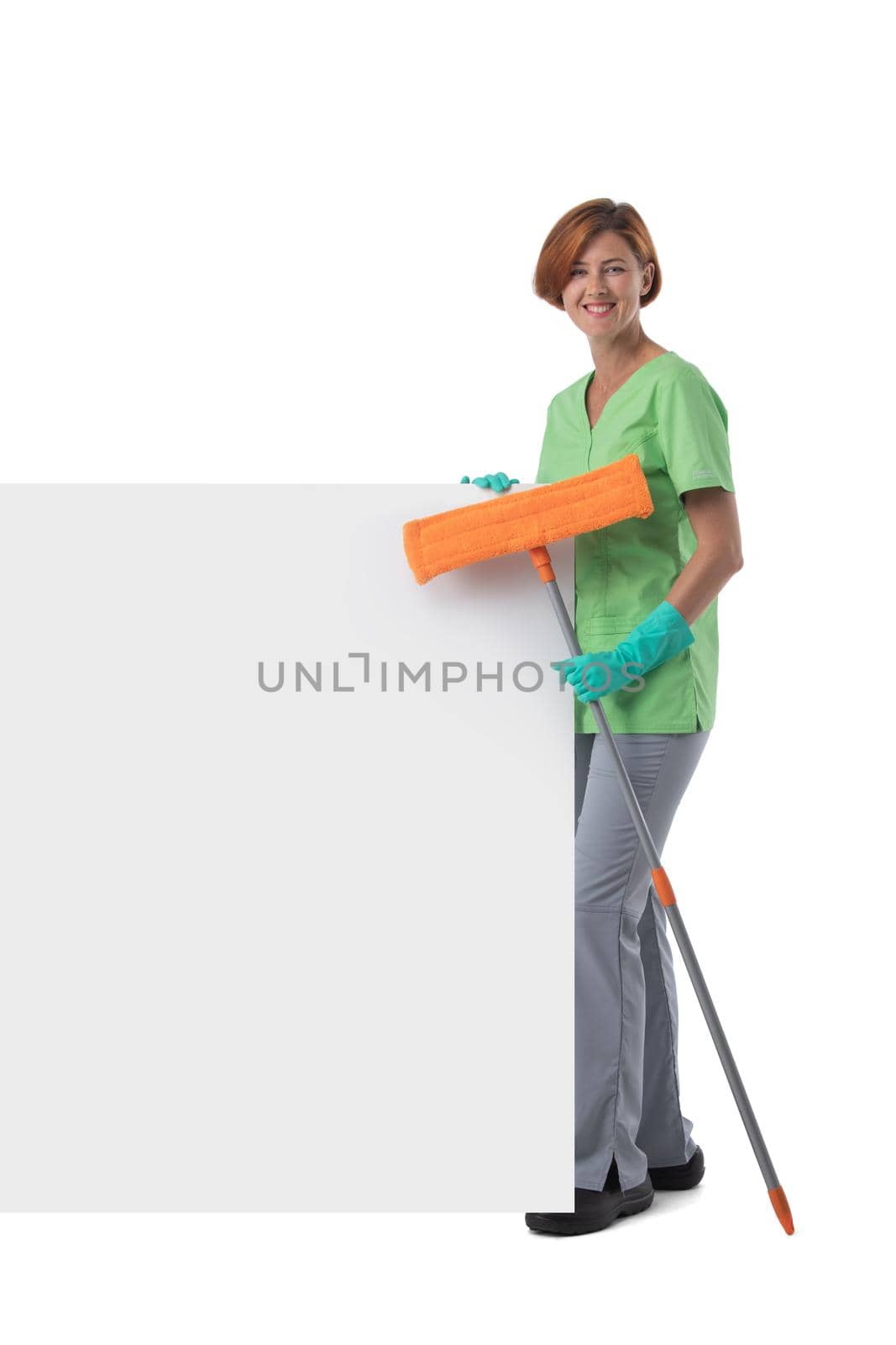 Cleaner woman with mop and blank banner isolated on white background, full length portrait