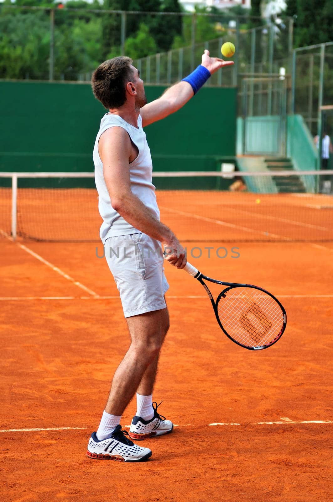 One man play tennis on outdoor court