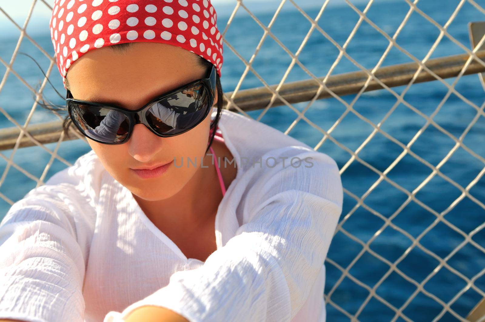 woman with sunglasses face portrait sea background