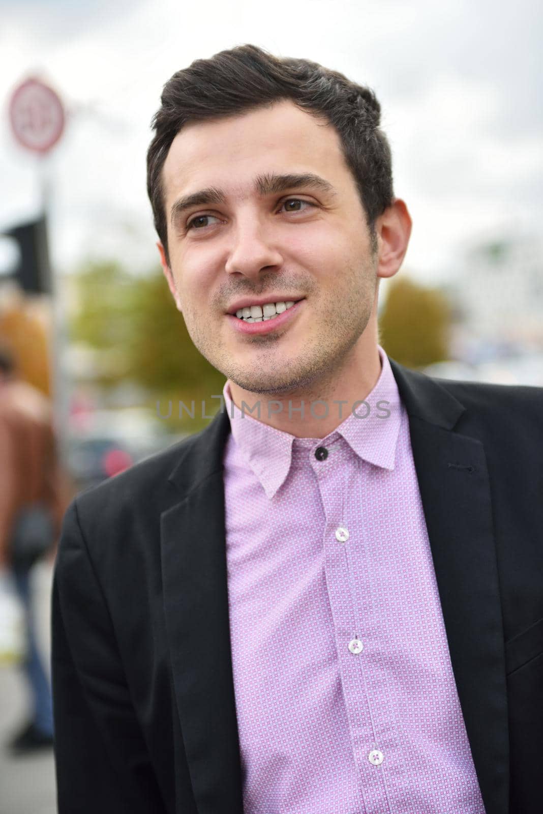 happy young business man portrait putdoor on street