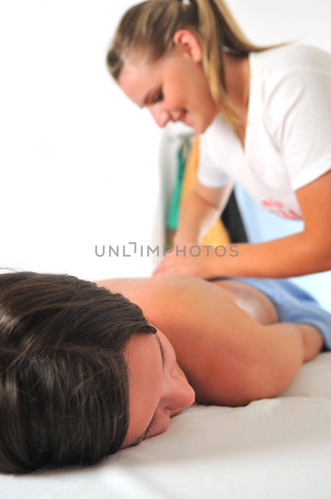 back massage at the spa and wellness center by dotshock