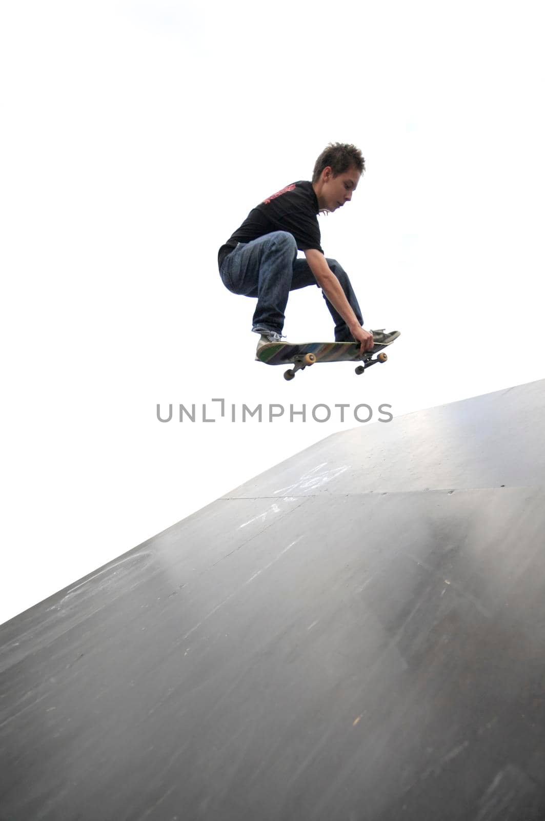 Boy practicing skate in a skate park