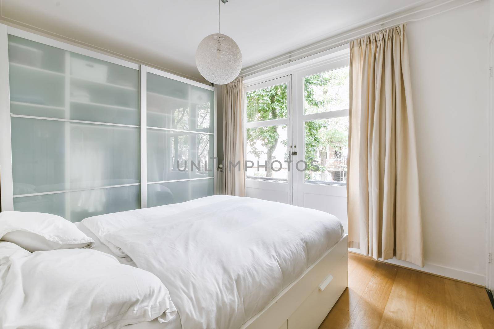 Cozy bedroom with a large soft bed