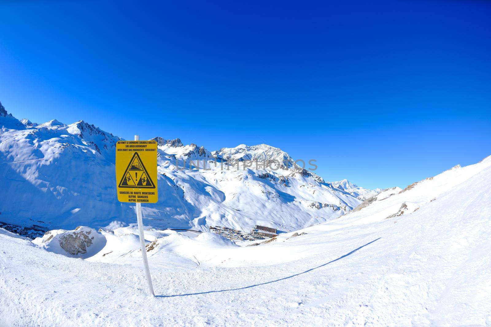 Sign board at High mountains under snow in the winter by dotshock