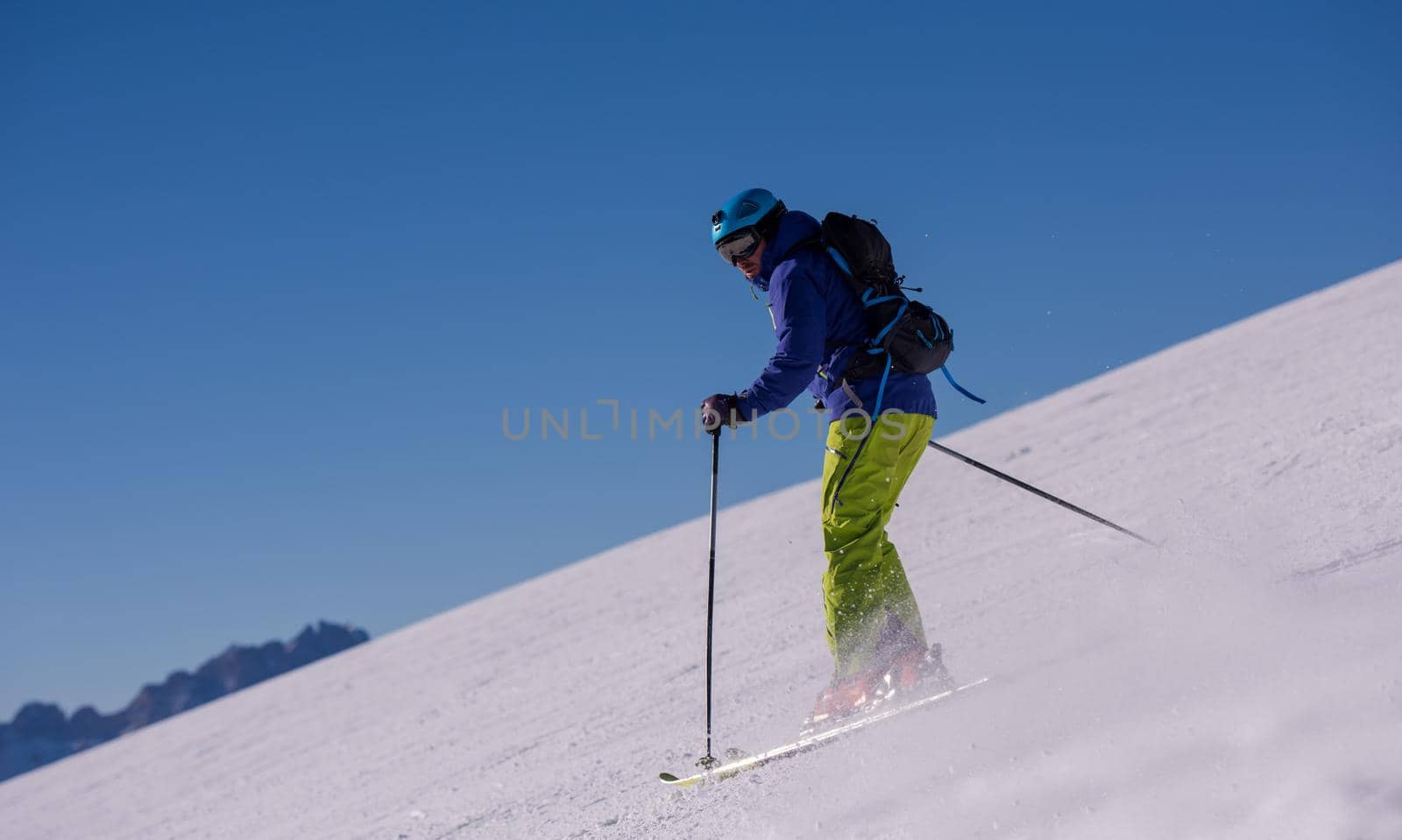 Skier having fun while running downhill by dotshock