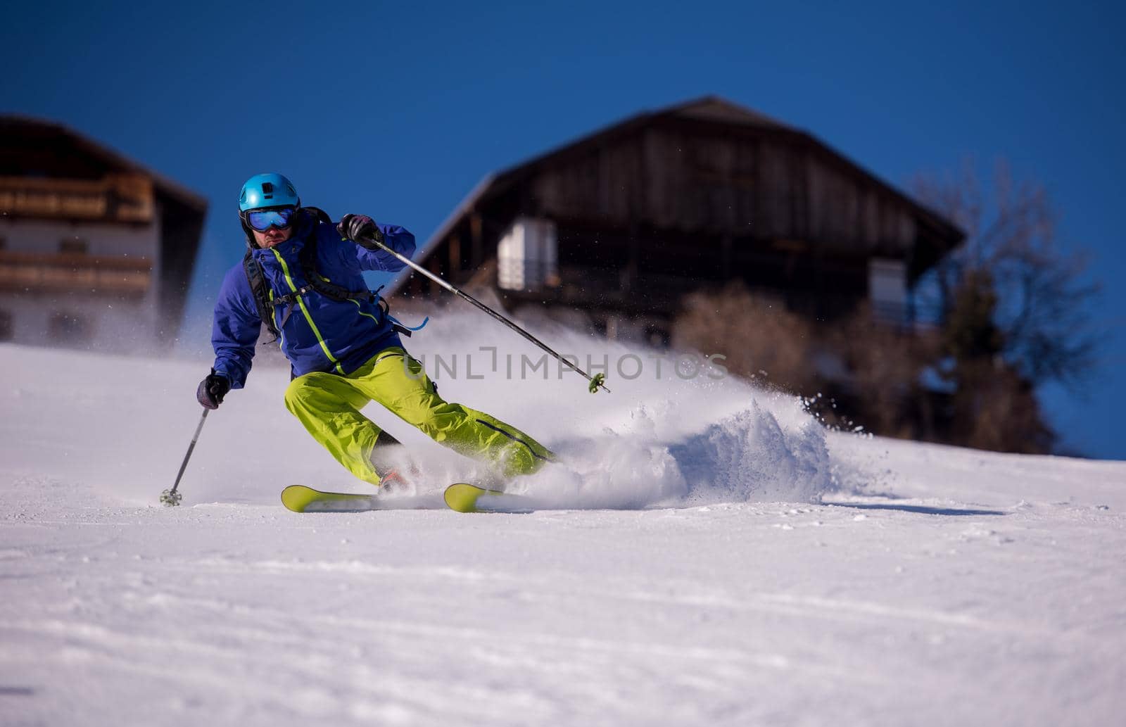 Skier having fun while running downhill by dotshock