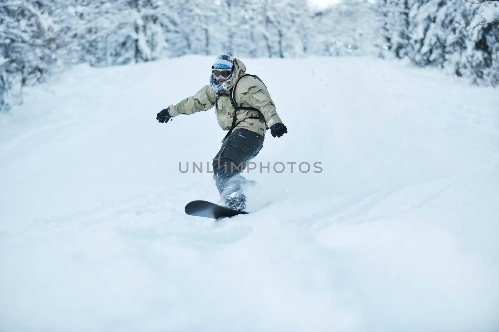 freestyle snowboarder jump and ride by dotshock