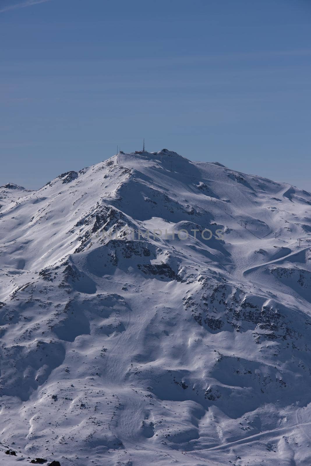 mountain landscape at winter with fresh snow on beautiful sunny day at french alps
