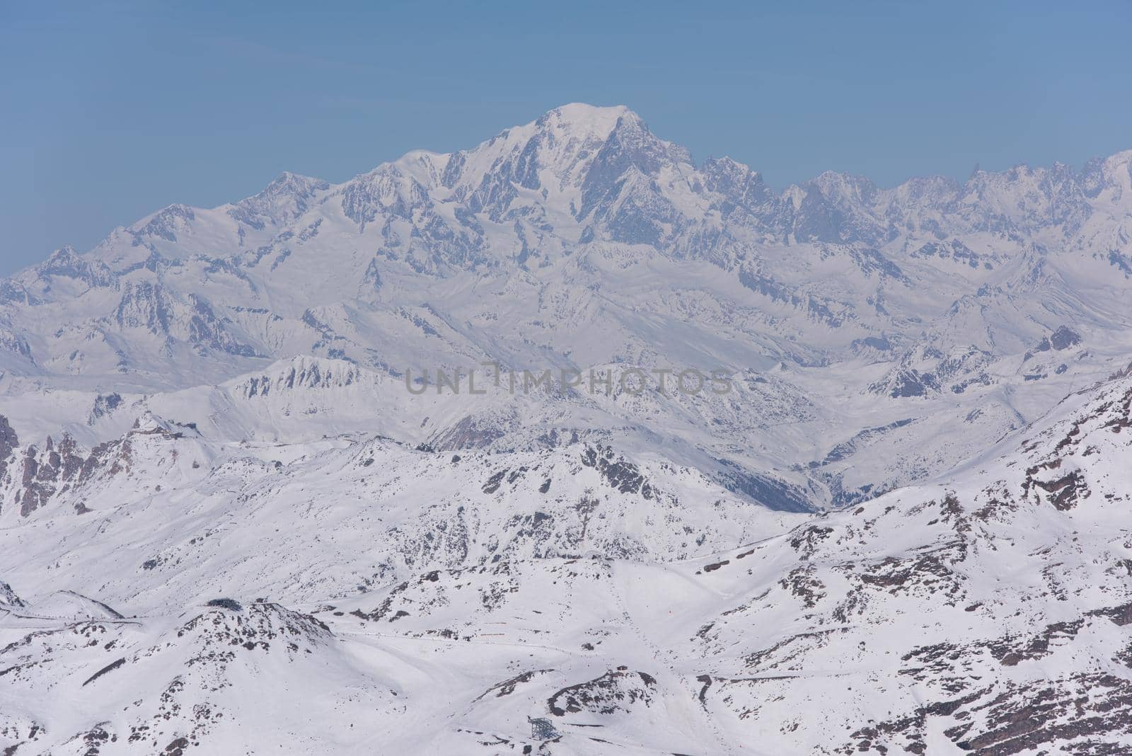 mountain landscape at winter with fresh snow on beautiful sunny day at french alps