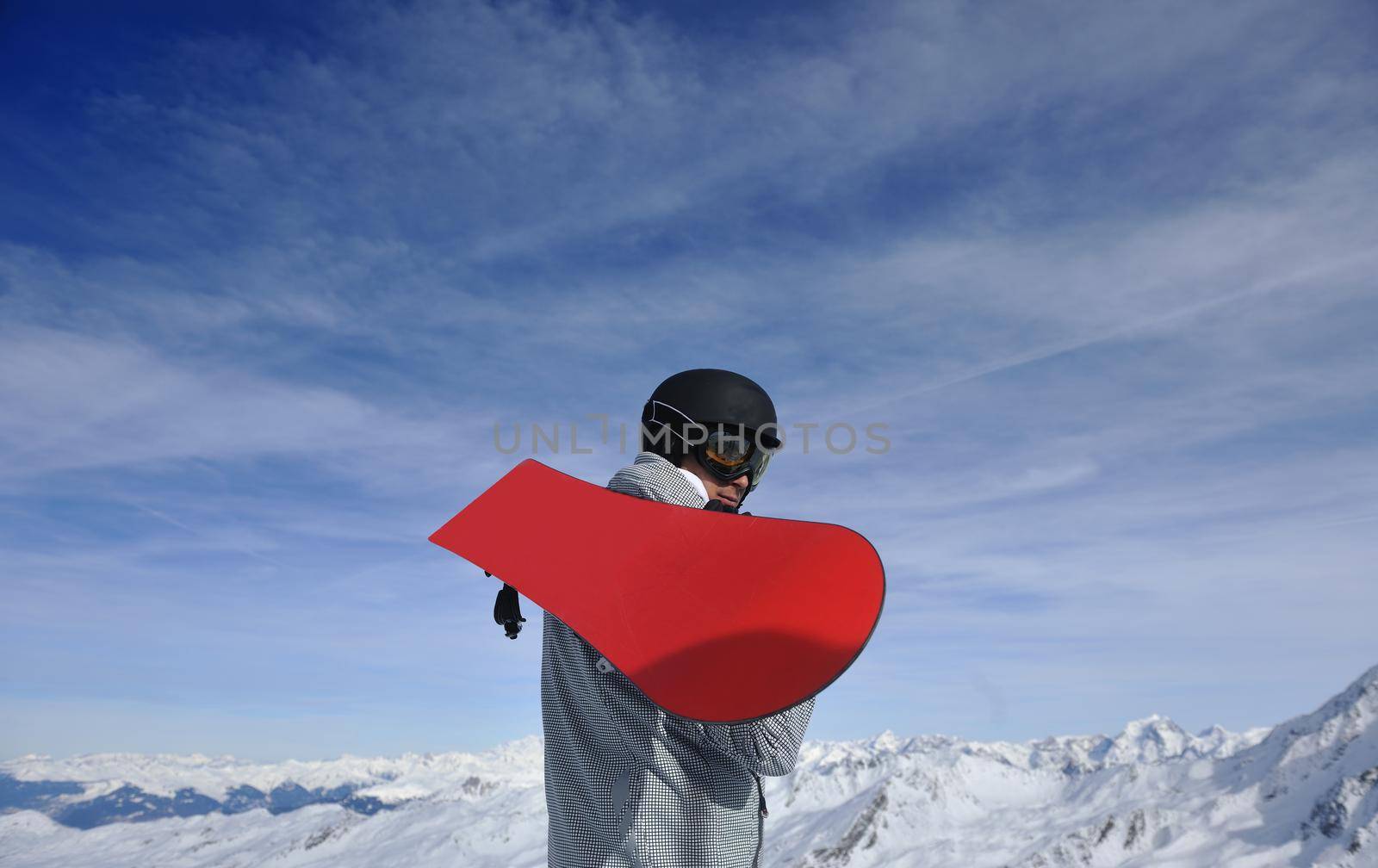 happy young man have fan while relaxing at snow with ski and snowboard sport at winter season