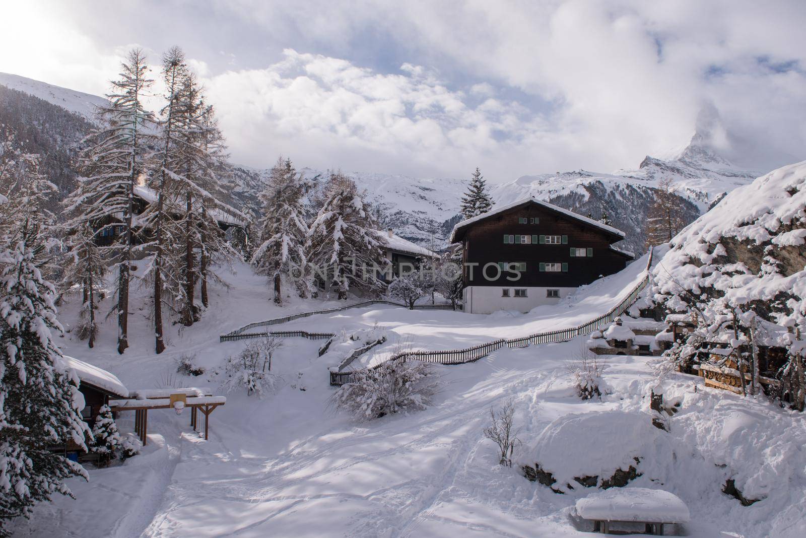 a beautiful landscape with mountain houses at cold winter day