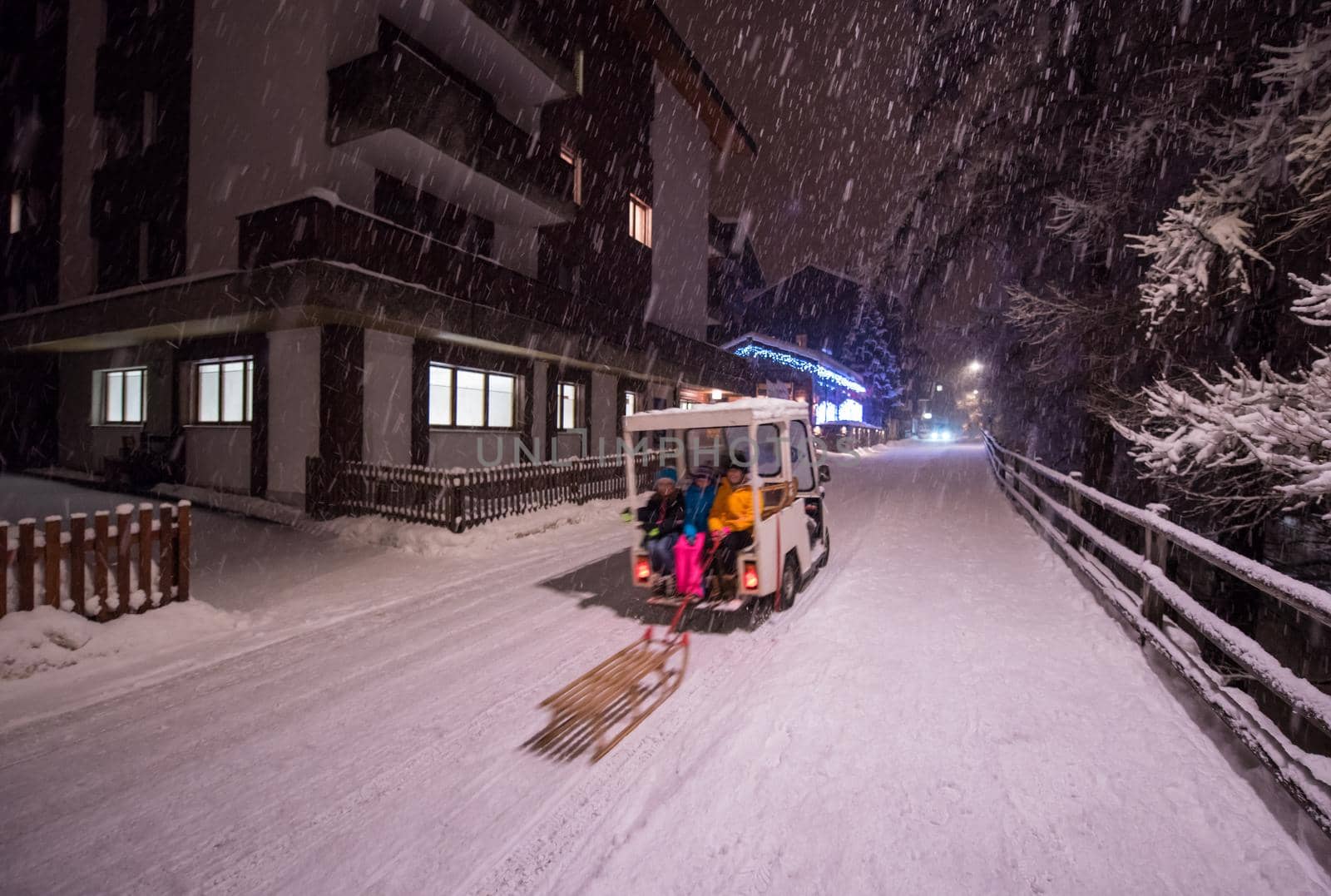 a view on snowy streets of the Alpine mountain village in the cold winter night