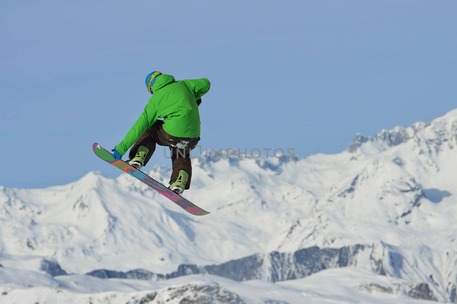 jumping skier at mountain winter snow fresh suny day