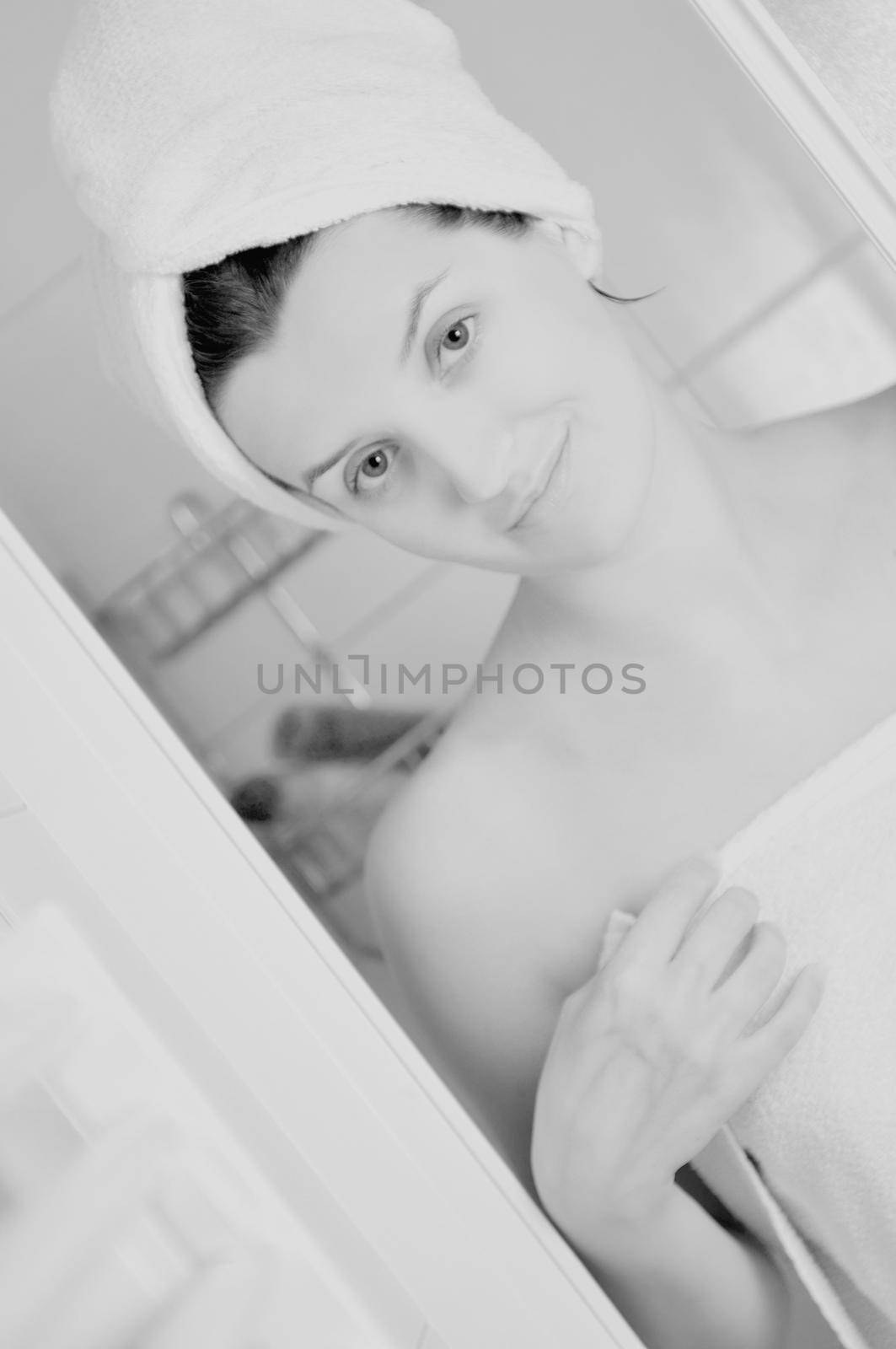 Young beautiful happy smiling tanned brunett woman at  shower in bathroom