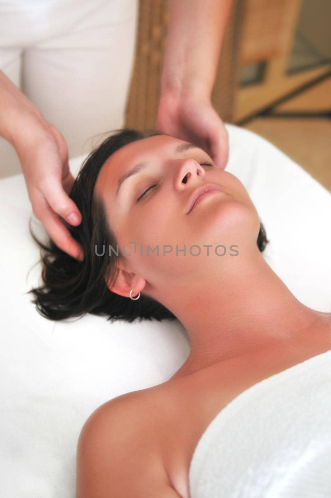 beautiful woman have massage at spa and wellness center by dotshock