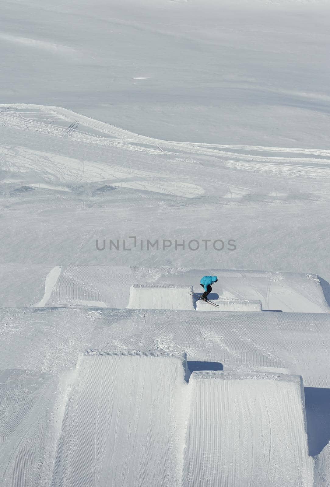 jumping skier at mountain winter snow fresh suny day