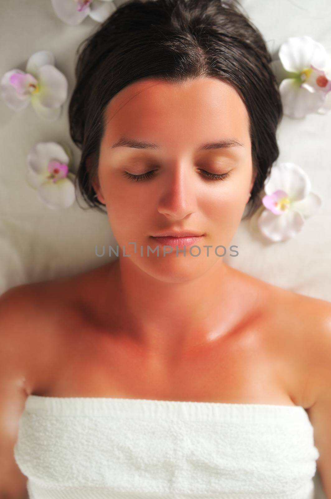 beautiful woman have massage at spa and wellness center by dotshock