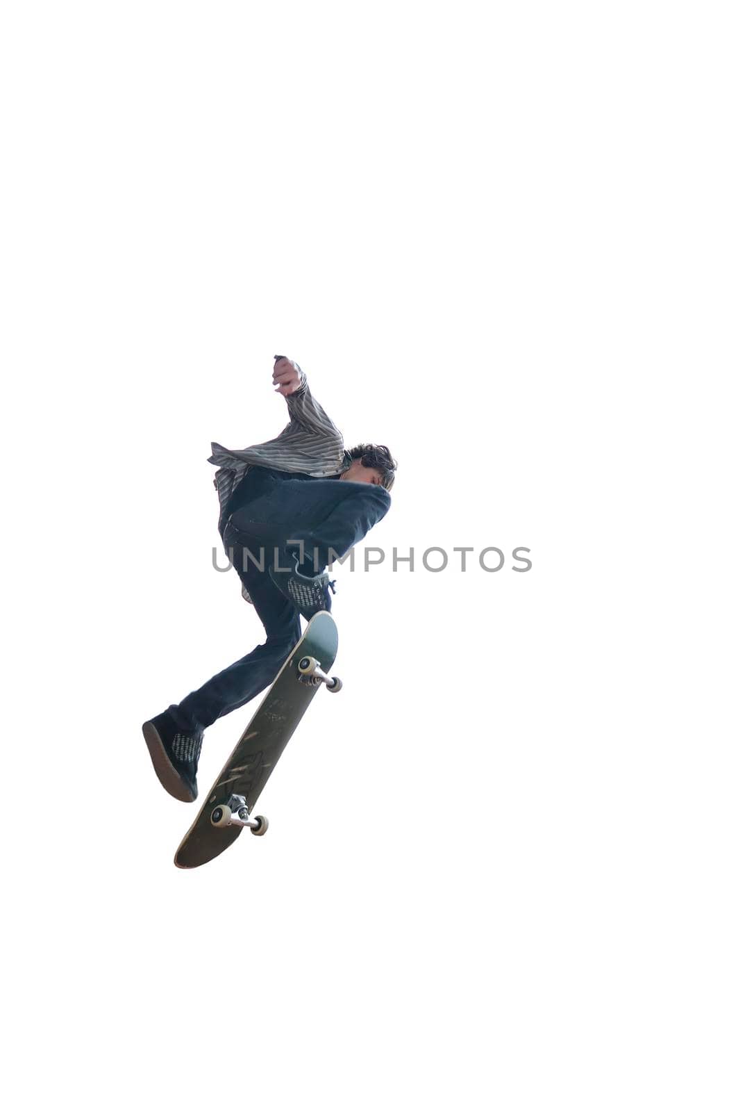 Boy practicing skate in a skate park - isolated by dotshock