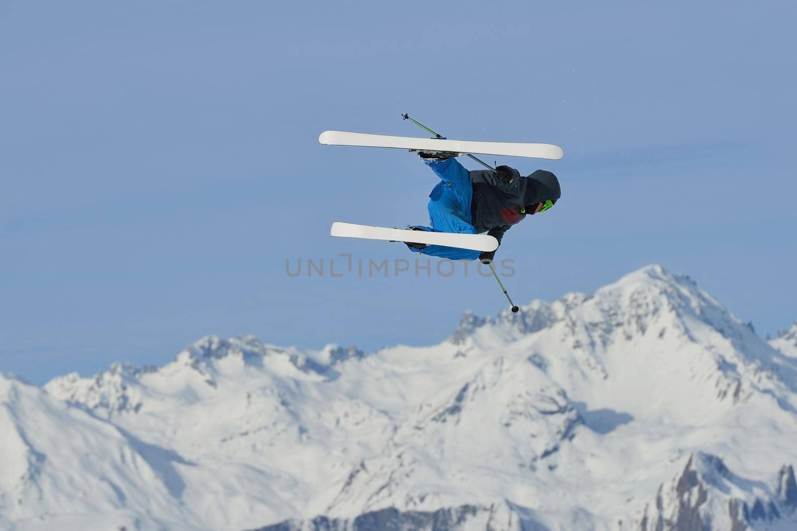 jumping skier at mountain winter snow fresh suny day