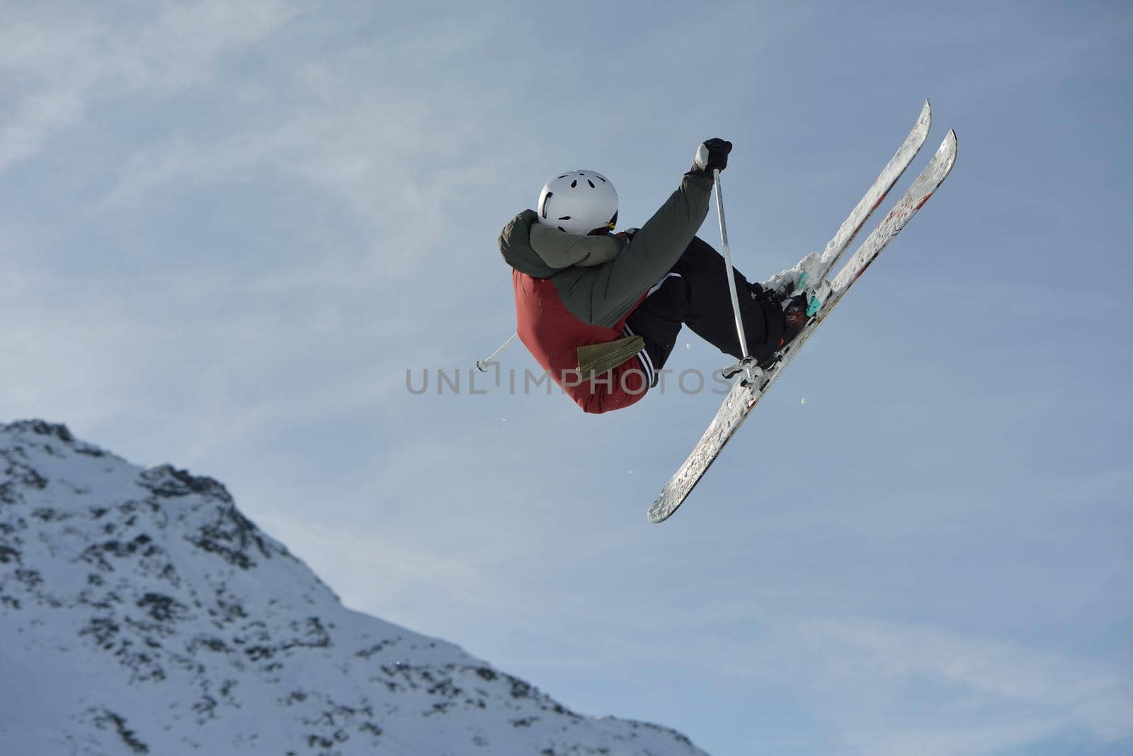 jumping skier at mountain winter snow fresh suny day