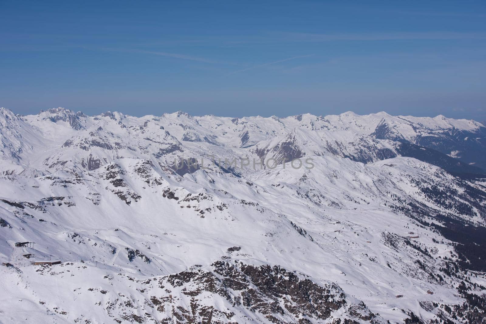 mountain landscape at winter with fresh snow on beautiful sunny day at french alps