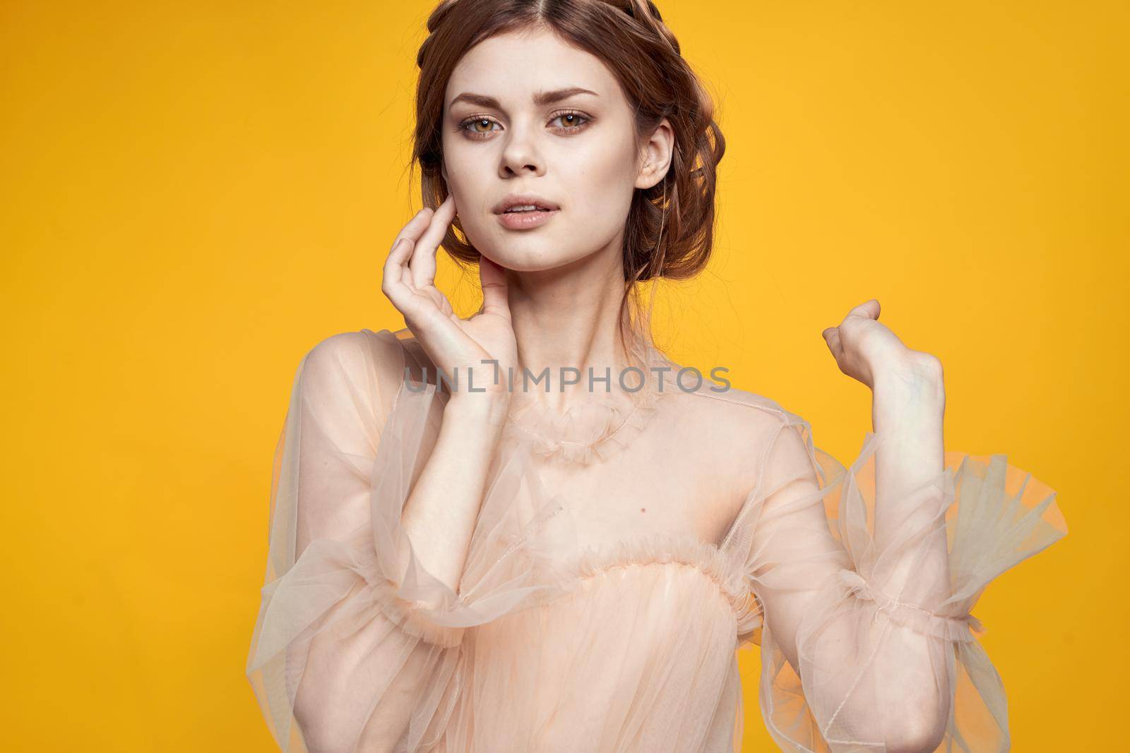 cheerful woman attractive look lifestyle romance yellow background. High quality photo