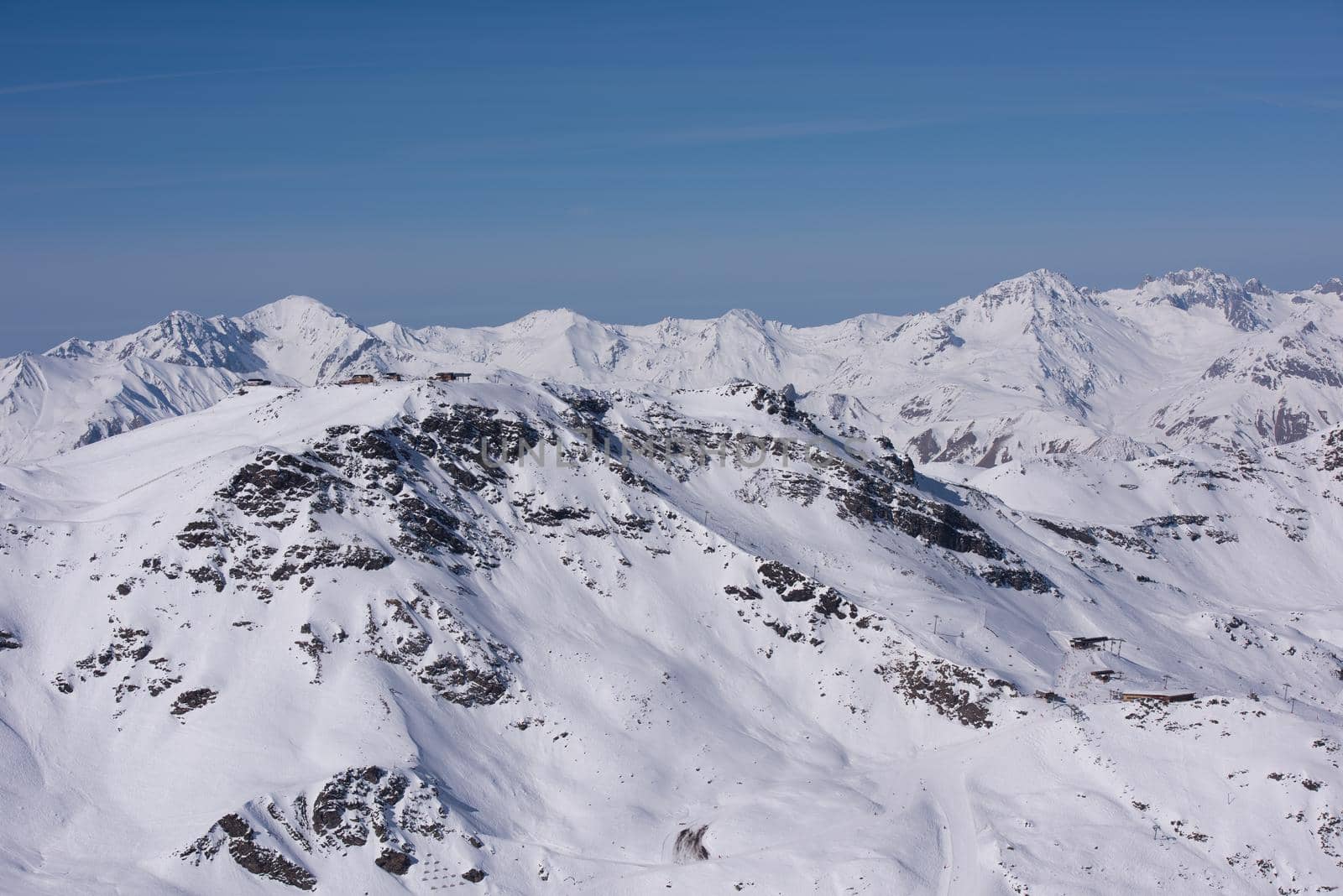 mountain landscape at winter with fresh snow on beautiful sunny day at french alps