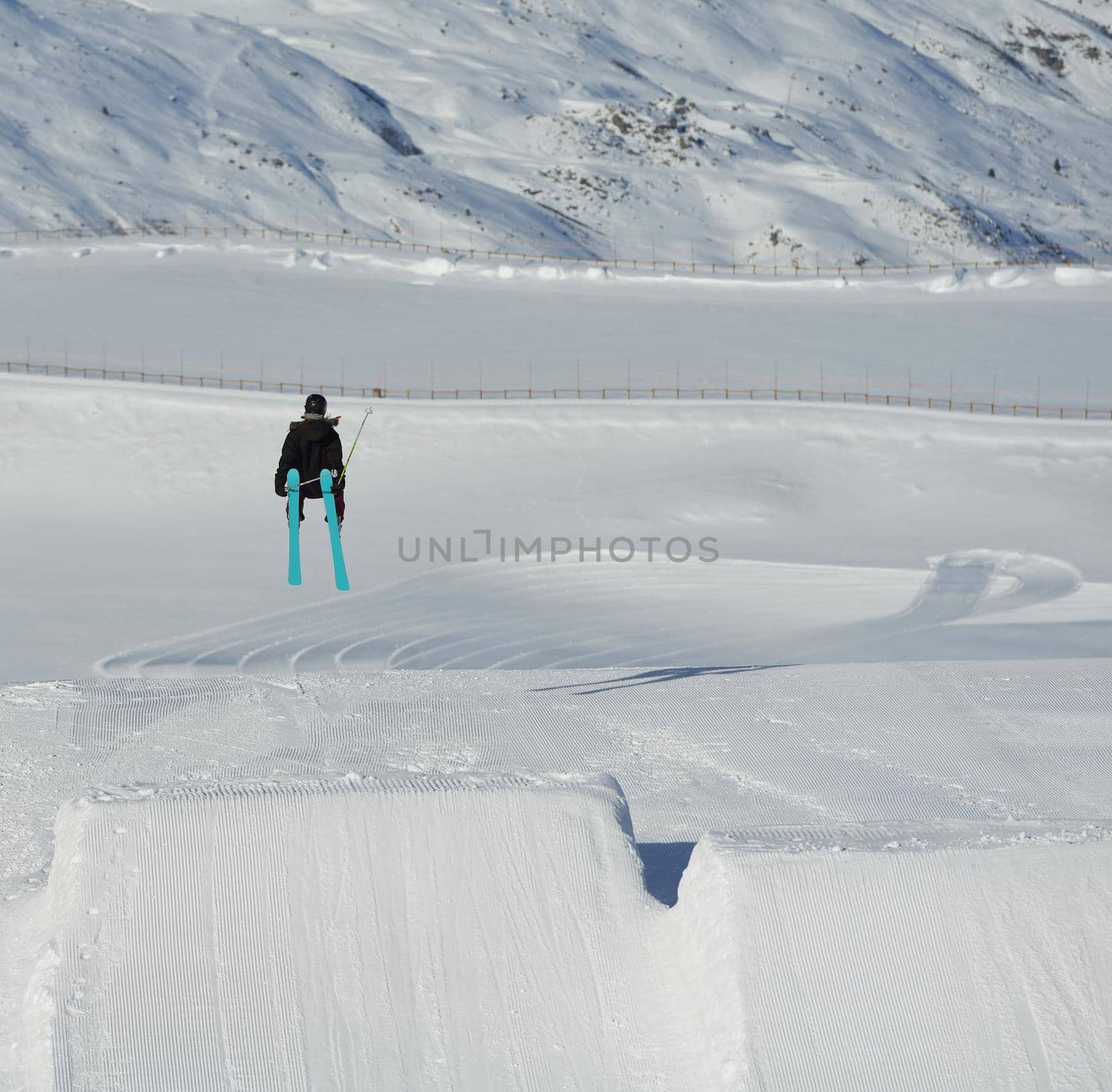 jumping skier at mountain winter snow fresh suny day