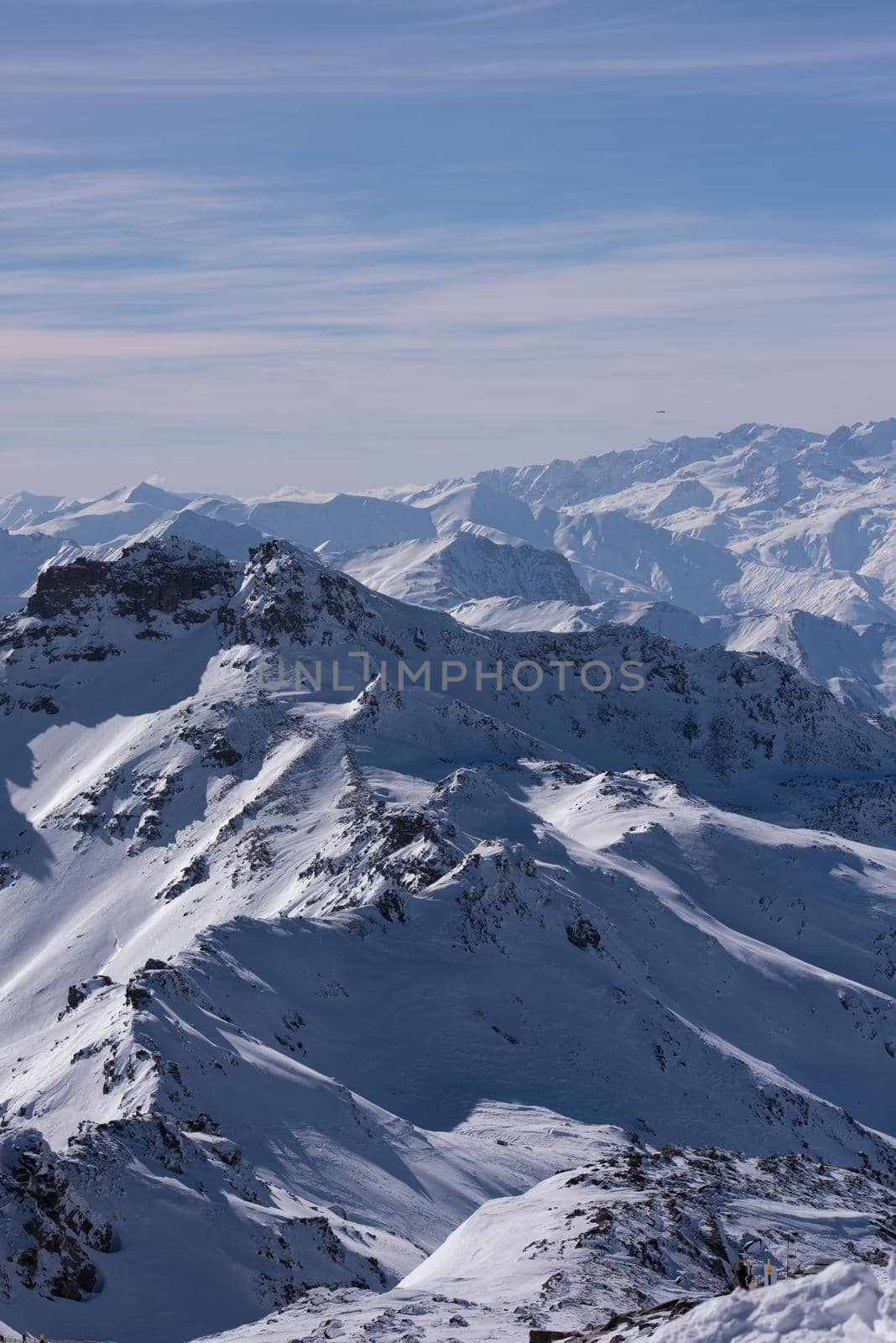 mountain landscape at winter with fresh snow on beautiful sunny day at french alps