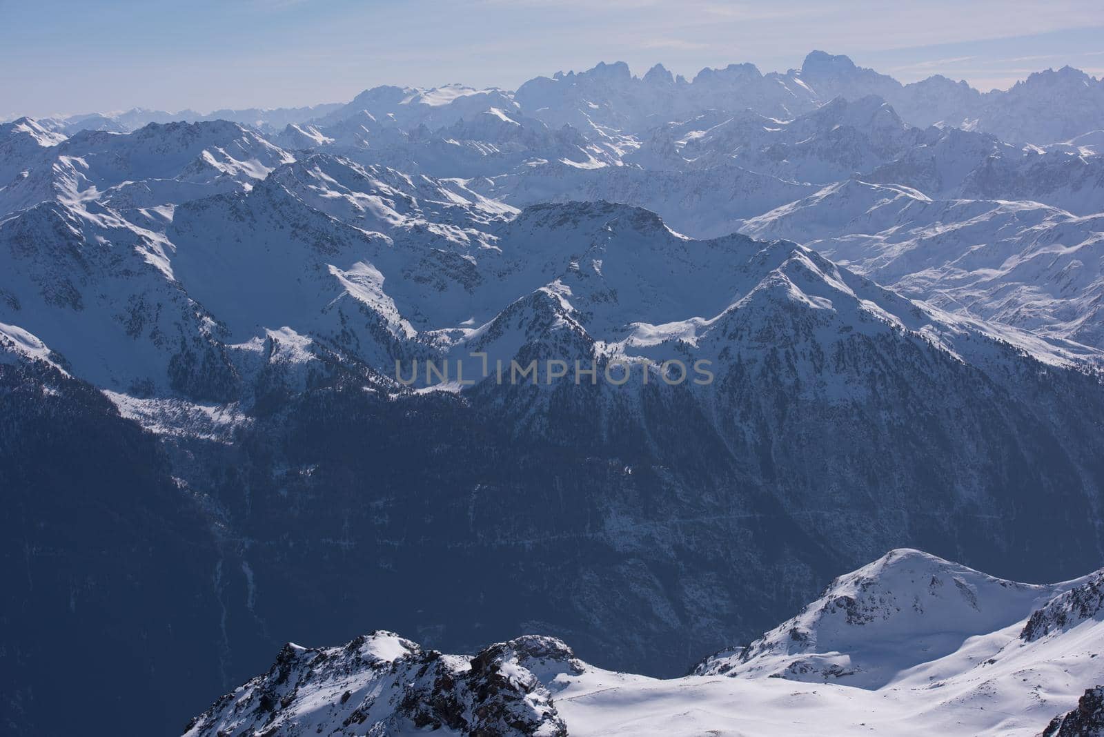 mountain landscape at winter with fresh snow on beautiful sunny day at french alps