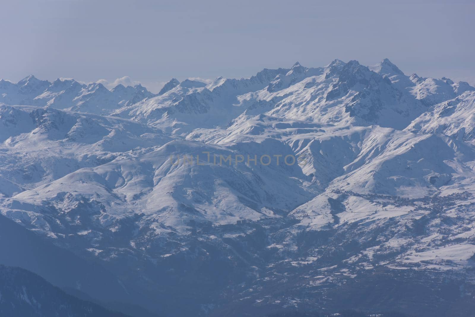 mountain landscape at winter with fresh snow on beautiful sunny day at french alps